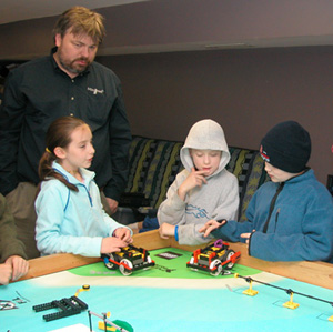 Coach Ericson, Megan, Luke, and David J at the table